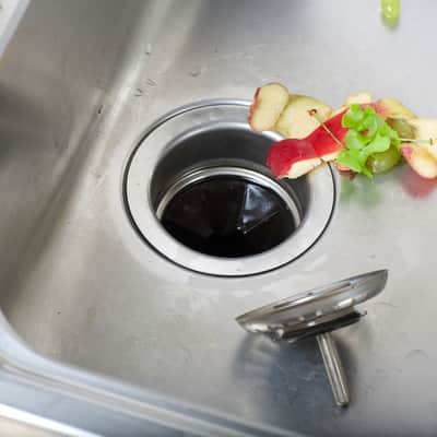 how to remove a garbage disposal stuck drain flange