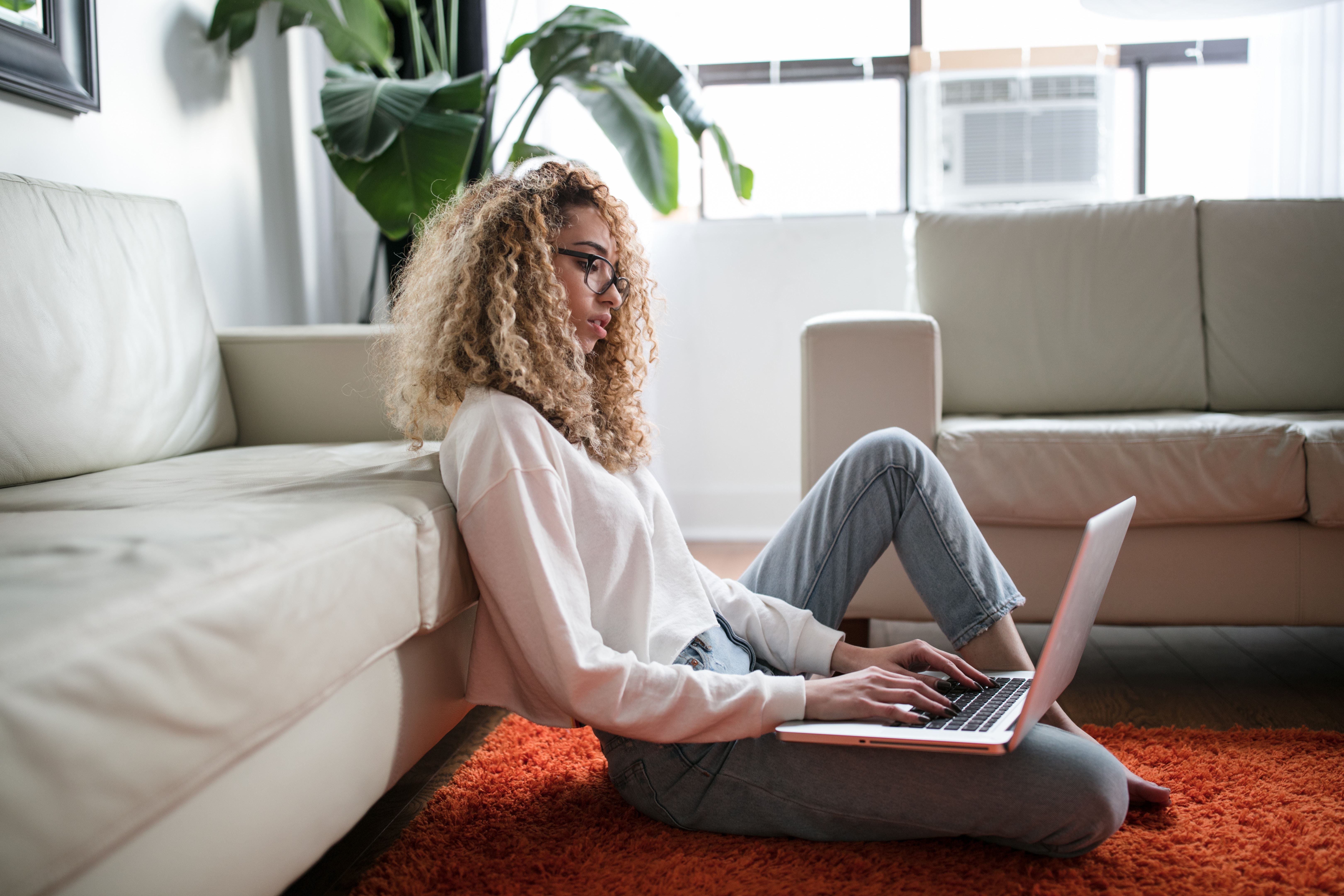 Cleaning, laundry and housekeeping with woman in living room for